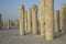 Young woman in a middle of concrete pilings