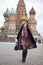 Young woman in a mink coat on the Red Square in Moscow