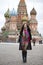 Young woman in a mink coat on the Red Square in Moscow