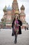 Young woman in a mink coat on the Red Square in Moscow