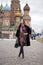 Young woman in a mink coat on the Red Square in Moscow