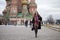 Young woman in a mink coat on the Red Square in Moscow