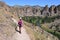 Young woman on Misery Ridge Trail in Smith Rock State Park, Oregon.