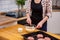 Young woman mixing cheese dough with a spoon in kitchen