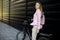 Young woman with modern city electric e-bike as clean sustainable urban transportation