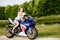 Young woman with a motorcycle speed