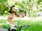 Young woman with mountain bike drinking water