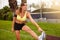 Young woman muscle stretching while looking away