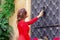 Young woman near ancient door