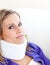 Young woman with a neck brace