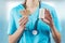 Young woman nurse or doctor hands closeup while presenting first aid items, bandage and patches