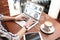 Young woman with open desktop on laptop screen working in cafe