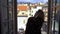 Young Woman Opening Window Morning Italian medieval town.