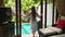 Young Woman Opens Doors to Pool at Morning, Woman on Vacation at Luxury Villa