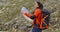 Young woman out hiking checking a map