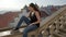 Young woman over the rooftops of Porto in Portugal