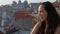 Young woman over the rooftops of Porto in Portugal