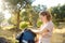 Young woman is packing her backpack during hiking in summer nature. Concepts of adventure, extreme survival, orienteering.