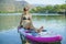 Young woman paddle the SUP board in the sea