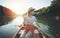 Young woman paddling canoe