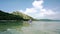 Young woman paddling a canoe on the sea during summer vacation in Indonesia