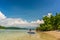 Young woman paddling during vacation in an idyllic travel destination