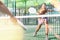 Young woman padel tennis player trains on the outdoor court