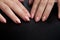 Young woman palms on black background. Close up. Beautiful Glamorous Manicure.