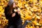 Young woman in the park autumn vibrant colors