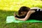 Young woman in park practicing yoga. Paschimottanasana Pose