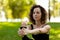 Young woman in park practicing yoga. Standing Hand to Toe Preparation