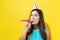 Young woman with party hat with noisemaker