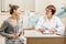 Young woman patient with gynecologist in the office
