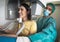 Young woman patient standing in x-ray machine - Dentist doing panoramic dental radiography