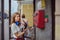 Young woman with pay phone outside