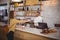 Young woman paying through card to waiter at counter