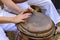 Young woman percussionist hands playing a drum