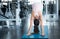 A young woman perform yoga activity in the gym