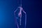 A young woman performing in a circus on aerial silk in the dark with blue light. A female equilibrist balancing on a
