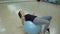 Young woman performs exercises with a gymnastic ball. Beginner in sport