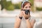 Young woman photographer portrait. Soft colors.