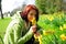 Young woman picking daffodils