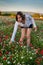 Young woman picking flowers  in poppy feild.,in the evening  ,relaxing ,provence France