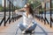 Young woman on the pier at the river