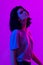 Young woman in pink blue neon lights. Creative colorful portrait