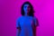 Young woman in pink blue neon lights. Creative colorful portrait