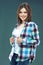 Young woman plaid shirt dressed.