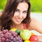 Young woman with plate of fruits. Healthy eating, beauty and dieting concept