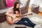 young woman play acoustic guitar