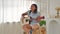 Young woman playing guitar and relaxing at home, Positive woman with prosthetic leg having fun on weekend at home